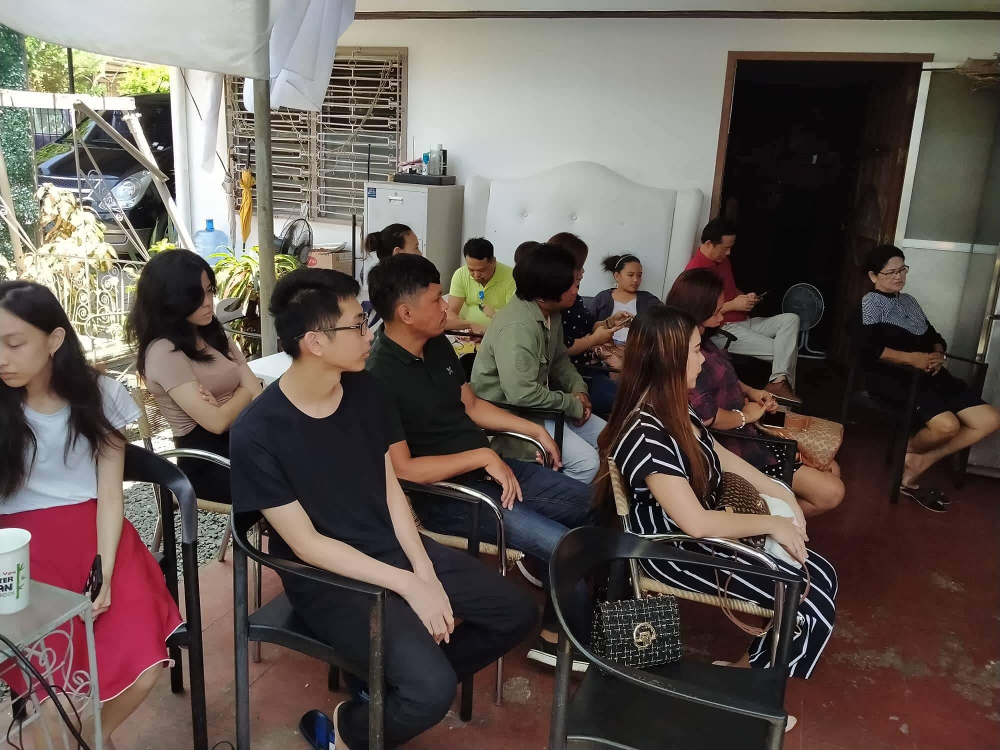 People seated together at one of Gateway Impact Church’s first garage gatherings in Cebu, September 2022